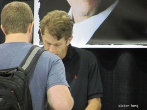 The voice of Batman, Kevin Conroy, signs autographs for a fan